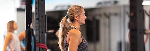 group of people listening to their coach exercise instructions
